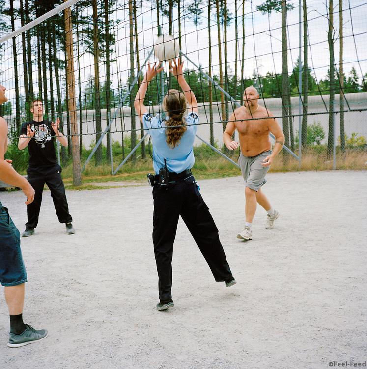 Halden Prison, Norway, June 2014: Female prison guard playing volleyball with prisoners in the afternoon.  -- No commercial use -- Photo: Knut Egil Wang/Moment/INSTITUTE