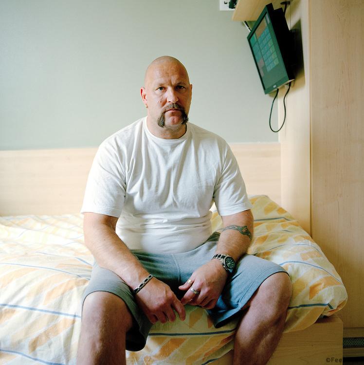 Halden Prison, Norway, June 2014: A prisoner in his cell. On the TV screen the prisoners can access internal prison info and a selection of TV channels.  -- No commercial use -- Photo: Knut Egil Wang/Moment/INSTITUTE