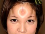 Tokyo, Japan: Marin poses with her bagel head. (Photo Credit: Beyond Productions)