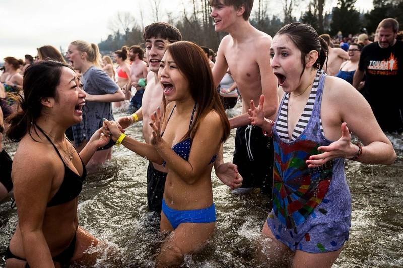 Girls react to the frigid waters of Pontiac Bay during the 12th Annual Polar Bear Plunge at Matthews Beach Park in Seattle. About 300 people participated in the first Polar Bear Plunge in 2003; since then, attendance has reached nearly 1,000 attendees. (Jordan Stead/seattlepi.com)