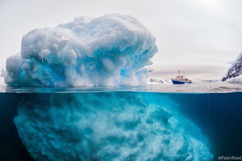 Mandatory Credit: Photo by Rick Du Boisson/Solent News/REX/Shutterstock (5597473a) Ship and iceberg Iceberg appears to make 3,000 tonne ship look tiny, Antarctic Peninsula. - Feb 2016 *Full story: http://www.rexfeatures.com/nanolink/s28m This iceberg appears to make a 3,000 tonne ship look tiny - when in fact the block of ice is only 6ft above sea level. A clever camera trick makes it seem as if the 'giant' iceberg dwarfs the ship as they appear to be next to each other. But because the iceberg is in the foreground of the picture, it makes it seem as though the colourful ship is a small toy - because it is 600ft away from the camera. The impressive photography skills makes the iceberg look disproportionately large and therefore appear to be much bigger than the ship. And although the iceberg is only a mere six feet above sea level, there is another 50ft of it underwater. The vessel is a research ship exploring Paradise Bay and Neko Harbour in the Antarctic Peninsula. Photographer Rick Du Boisson, 65, braved the freezing conditions to capture these deceiving shots of the ship and iceberg.