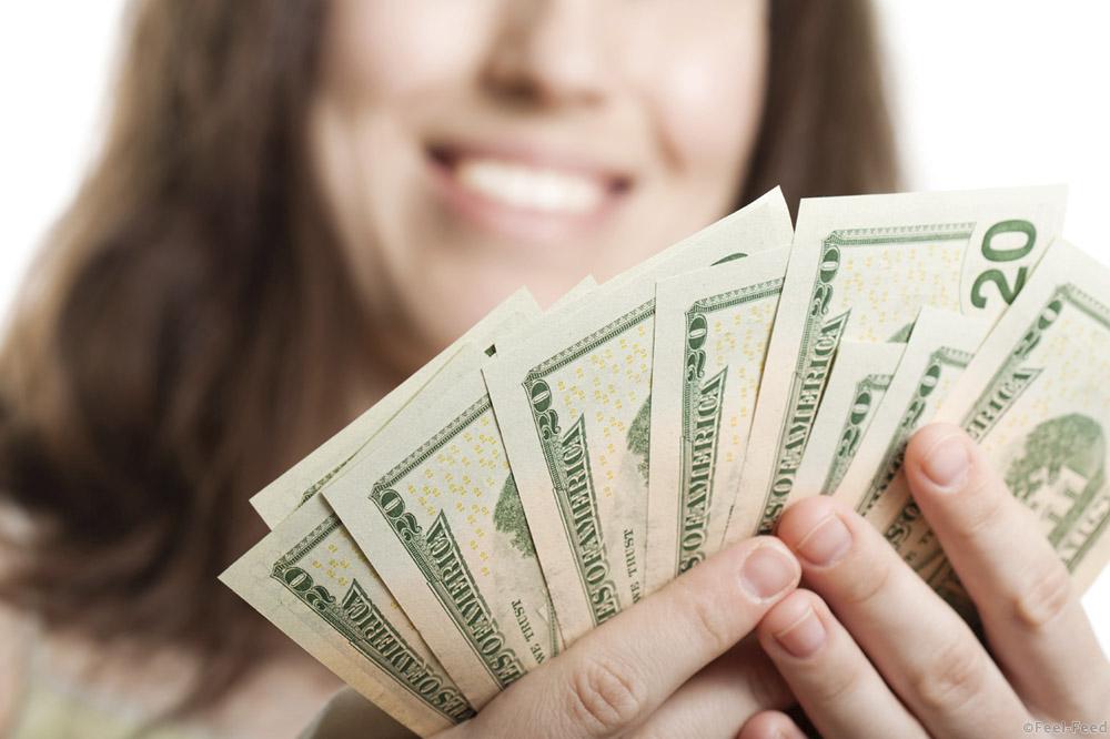 Finance businesswomen hand holding dollar currency