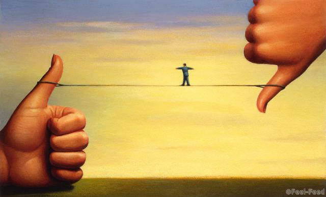 Tightrope Between Thumbs --- Image by © Images.com/Corbis