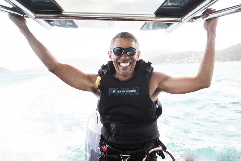 In this recent but undated photo made available by Virgin.com, former U.S President Barack Obama prepares to kitesurf during his stay on Moskito Island, British Virgin Islands. The former president and his wife stayed on Mosikto Island owned by Richard Branson, founder of the Virgin Group, after he finished his second term as President and left the White House. (Jack Brockway/Virgin.com via AP)