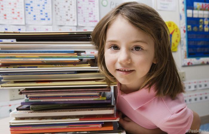 Little Girl with a Stack of Books Royalty free: For comercial usage price on demand