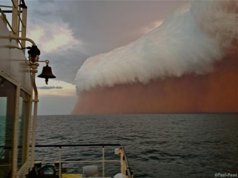 A cloud formation tinged with red dust travels across the Indian Ocean near Onslow on the Western Australia coast in this handout image distributed by fishwrecked.com and taken January 9, 2013. Picture taken January 9. REUTERS/Brett Martin/fishwrecked.com/Handout (AUSTRALIA - Tags: ENVIRONMENT SOCIETY) ATTENTION EDITORS - THIS PICTURE WAS PROVIDED BY A THIRD PARTY. REUTERS IS UNABLE TO INDEPENDENTLY VERIFY THE AUTHENTICITY, CONTENT, LOCATION OR DATE OF THIS IMAGE. FOR EDITORIAL USE ONLY. NOT FOR SALE FOR MARKETING OR ADVERTISING CAMPAIGNS. THIS PICTURE IS DISTRIBUTED EXACTLY AS RECEIVED BY REUTERS, AS A SERVICE TO CLIENTS