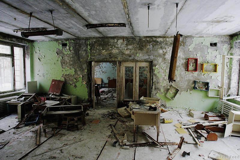 The remnants of an abandoned class room is seen in a pre-school in the deserted town of Pripyat on January 25, 2006 in Chernobyl, Ukraine. Prypyat and the surrounding area will not be safe for human habitation for several centuries. Scientists estimate that the most dangerous radioactive elements will take up to 900 years to decay sufficiently to render the area safe. (Photo by Daniel Berehulak/Getty Images)