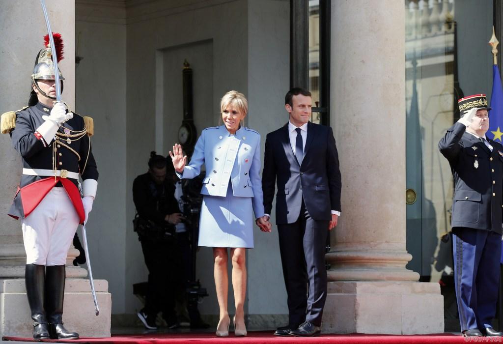 PARIS, FRANCE - MAY 14: Newly-elected President Emmanuel Macron and his wife Brigitte Trogneux pose on the steps of the Elysee Palace after the handover ceremony with France's outgoing President Francois Hollande on May 14, 2017 in Paris, France. Macron was elected President of the French Republic on May 07, 2017 with 66,1 % of the votes cast. (Photo by Thierry Chesnot/Getty Images)