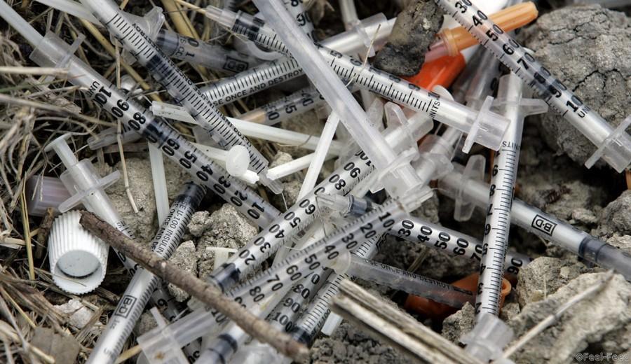 MAY 22, 2008 FILE PHOTO FILE - In this May 22, 2008 file photo, used syringes and needles are piled on the ground under an underpass on the west side of San Antonio where drug addicts shoot up. A U.N. human rights investigator says Wednesday, Sept. 14, 2011, up to a quarter of the world's trash from hospitals, clinics, labs, blood banks and mortuaries is hazardous and much more needs to be done to regulate it. (AP Photo/Eric Gay)
