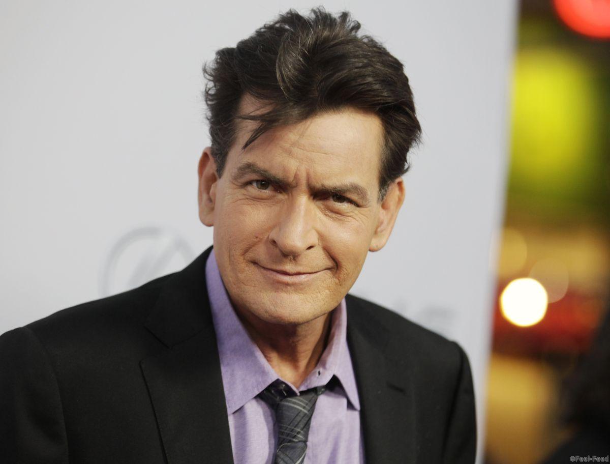 Cast member Charlie Sheen poses at the premiere of his new film "Scary Movie 5" in Hollywood April 11, 2013. REUTERS/Fred Prouser (UNITED STATES - Tags: ENTERTAINMENT PROFILE) - RTXYIG2
