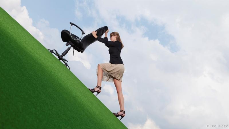Germany, Bavaria, Munich, Businesswoman pushing chair on lawn