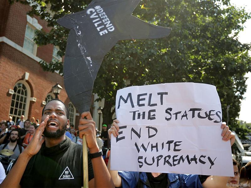 CHARLOTTESVILLE, VA - AUGUST 12: Counter-protesters line the route taken by white nationalists, neo-Nazis and members of the "alt-right" during the "Unite the Right" rally August 12, 2017 in Charlottesville, Virginia. After clashes with anti-fascist protesters and police the rally was declared an unlawful gathering and people were forced out of Lee Park, where a statue of Confederate General Robert E. Lee is slated to be removed. (Photo by Chip Somodevilla/Getty Images)