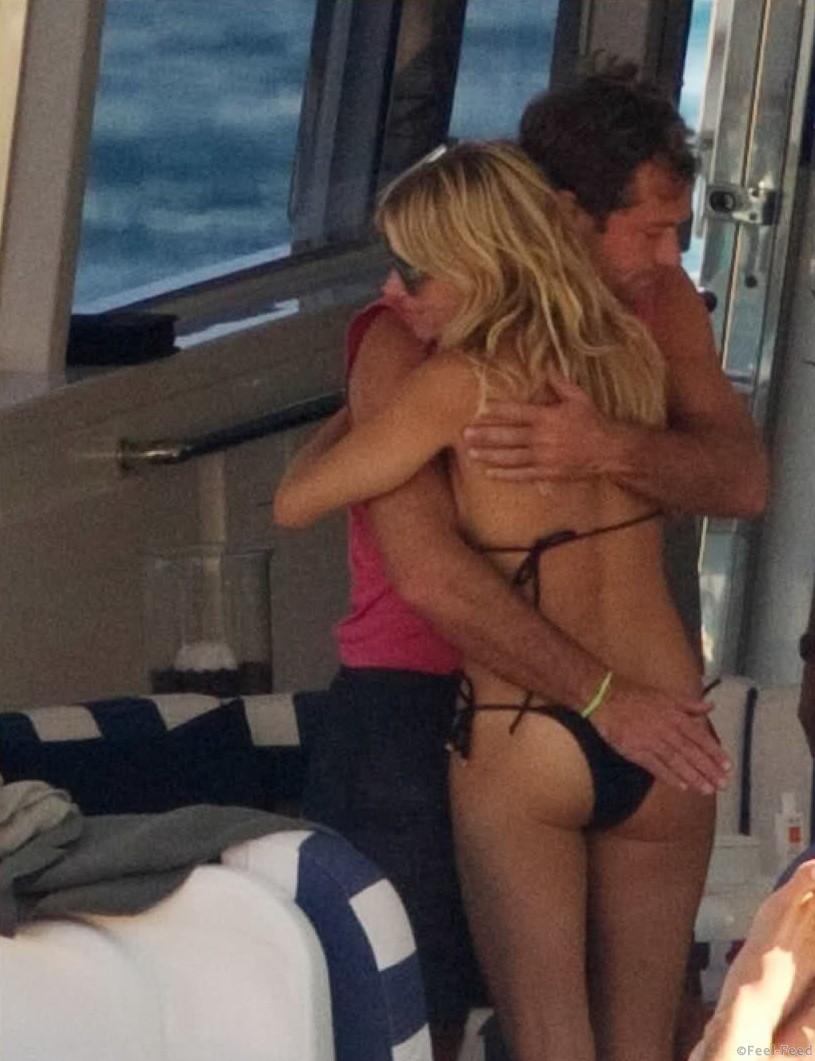 Sienna Miller and Jude Law relax with friends in Ibiza aboard an Italian motor yatch swimming in the warm water, sharing laughs, wine, and good friendship. After the trip to Es Torrent where they had lunch the group returned to the boat for a swim and drink. A motor to near by Island of Es Vedr taking in the sights, they retuned to the Ibiza Marina after dark. Later in that night the were seen in the VIP area of Pacha, and didn´t return home till 7:30 am.