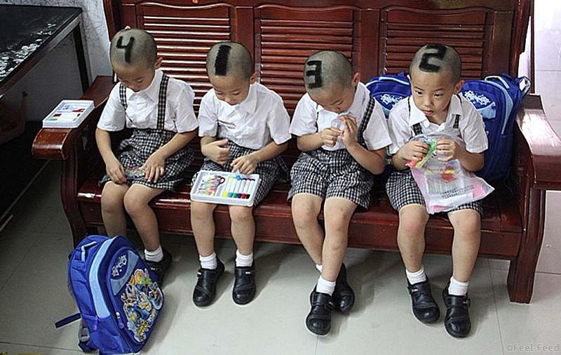 TOPSHOTS This picture taken on September 3, 2012, shows six-year-old quadruplets from Shenzhen, south China's Guangdong Province with their hair shaved into various numbers before they start go to school for their first time. Their parents decided to mark them with 1, 2, 3, 4 on their heads to make it easier for teachers and classmates to tell them apart. CHINA OUT AFP PHOTOSTR/AFP/GettyImages
