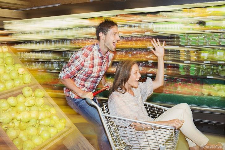 Mandatory Credit: Photo by Caiaimage/REX Shutterstock (4243309a) MODEL RELEASED, Blurred view of couple playing in grocery store VARIOUS