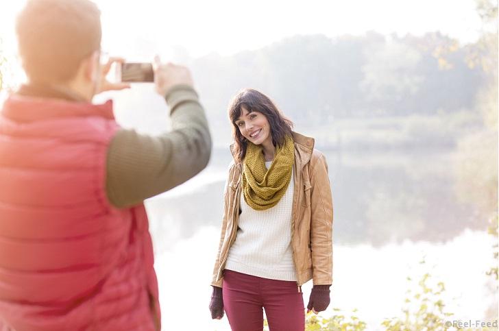 Mandatory Credit: Photo by Caiaimage/REX Shutterstock (4857411a) MODEL RELEASED, Husband photographing wife in front of autumn lake VARIOUS
